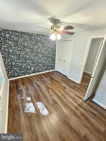 a bathroom with a sink mirror and toilet