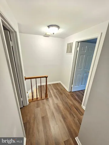 a view of entryway with wooden floor