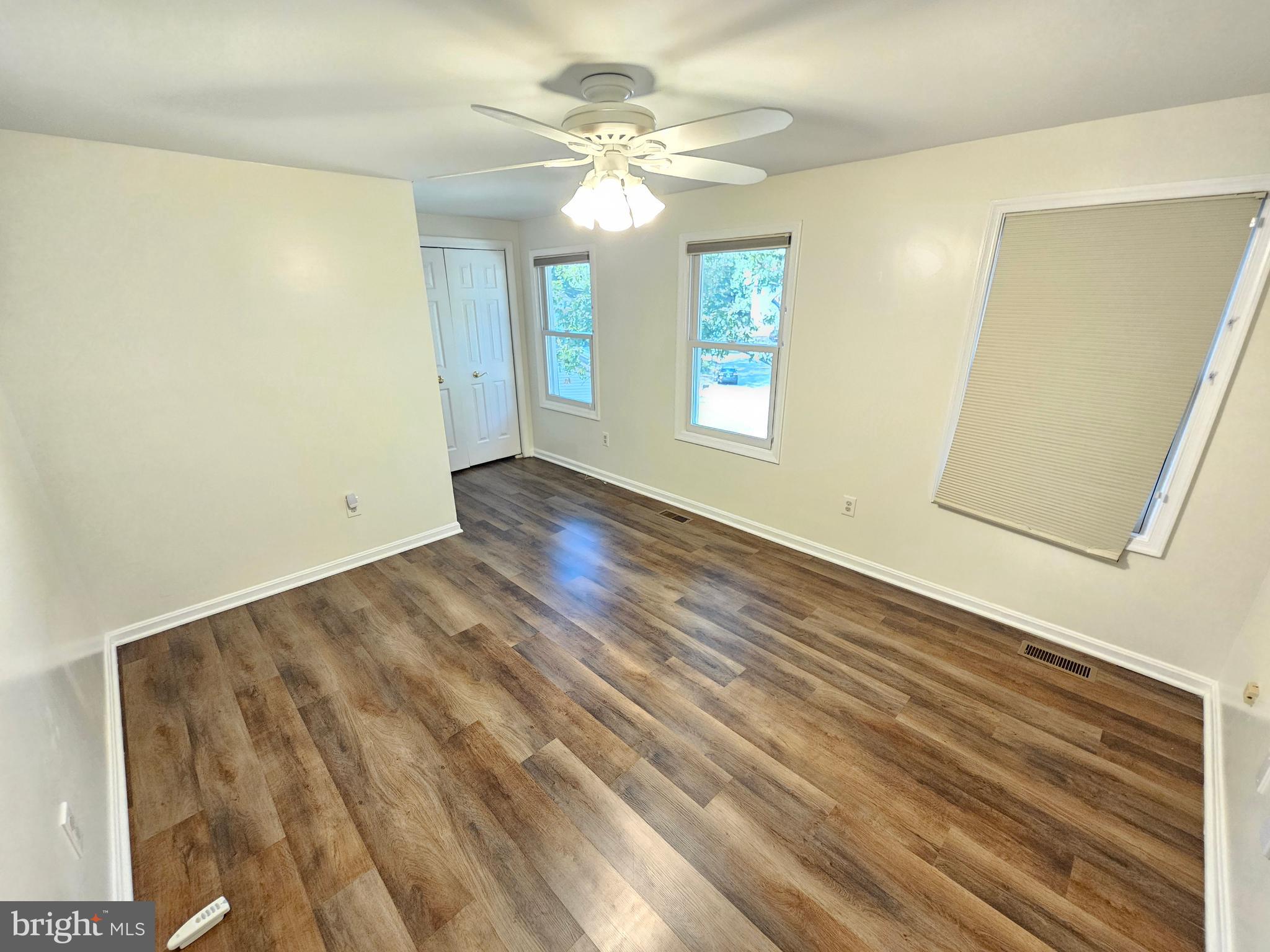 11321 Classical Lane Silver Spring, MD 20901 - Photo 38 of 66 wooden floor in an empty room with a window
