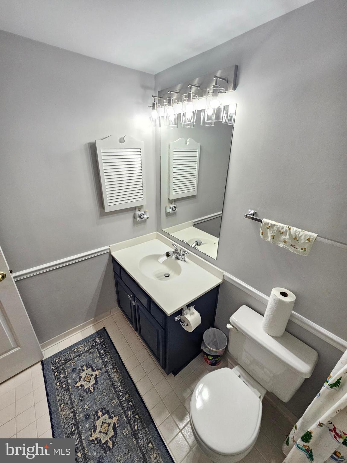 11321 Classical Lane Silver Spring, MD 20901 - Photo 41 of 66 a bathroom with a sink mirror and toilet