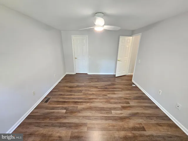 a view of backyard with deck and wooden floor