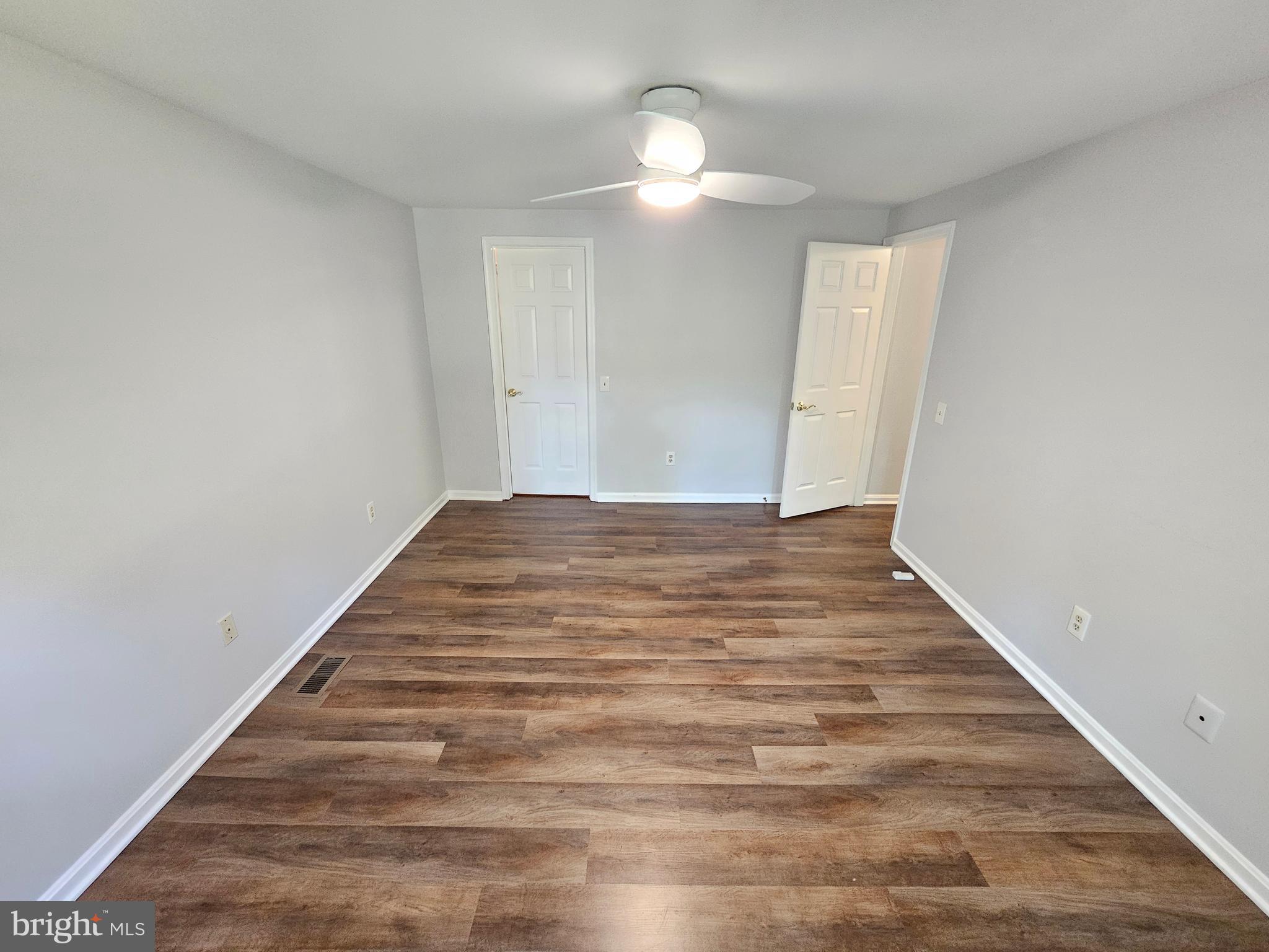 11321 Classical Lane Silver Spring, MD 20901 - Photo 42 of 66 a view of empty room with wooden floor
