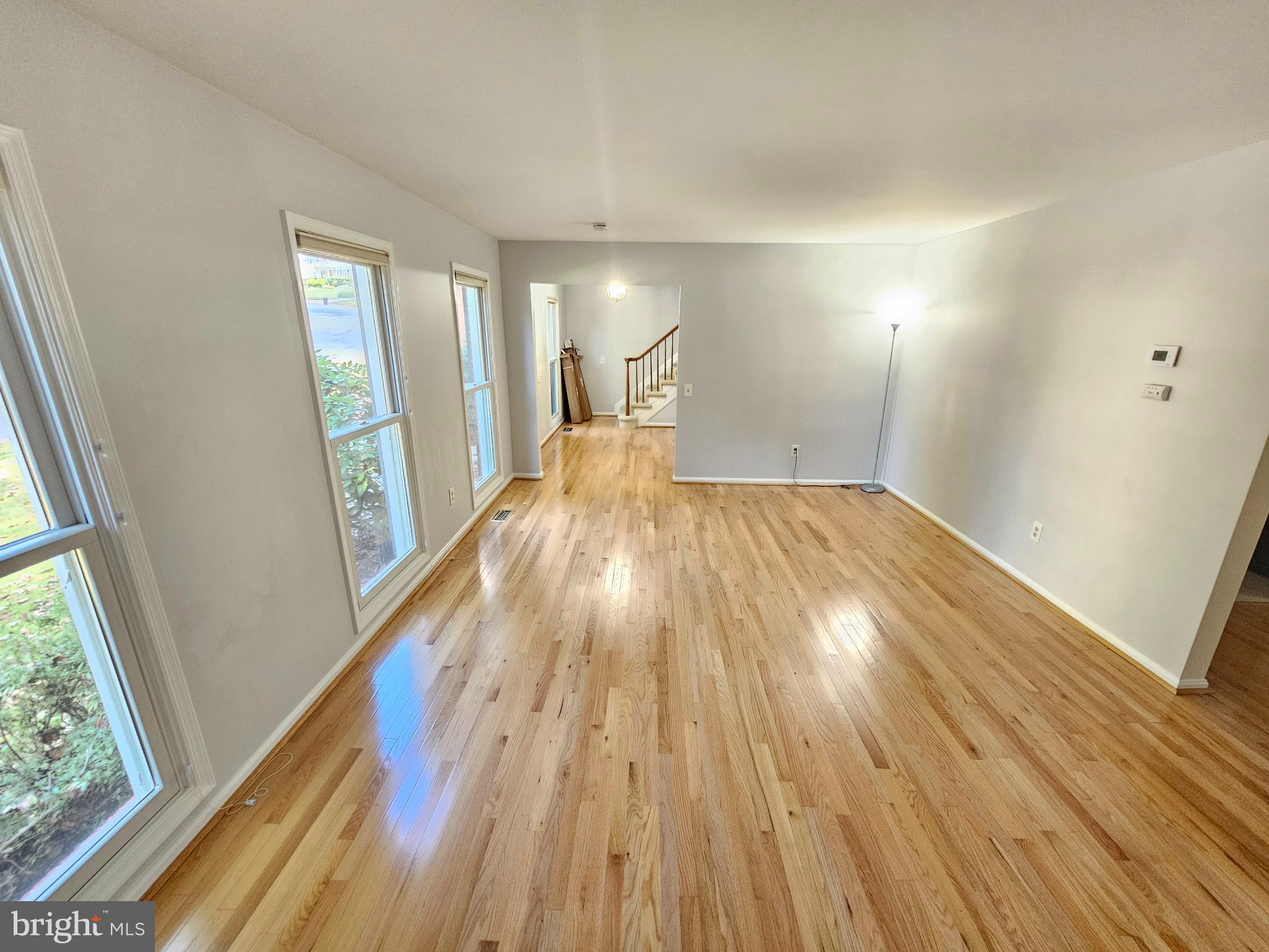 11321 Classical Lane Silver Spring, MD 20901 - Photo 7 of 66 a view of a room with wooden floor and window