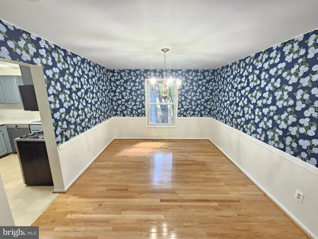 a view of an empty room with glass door