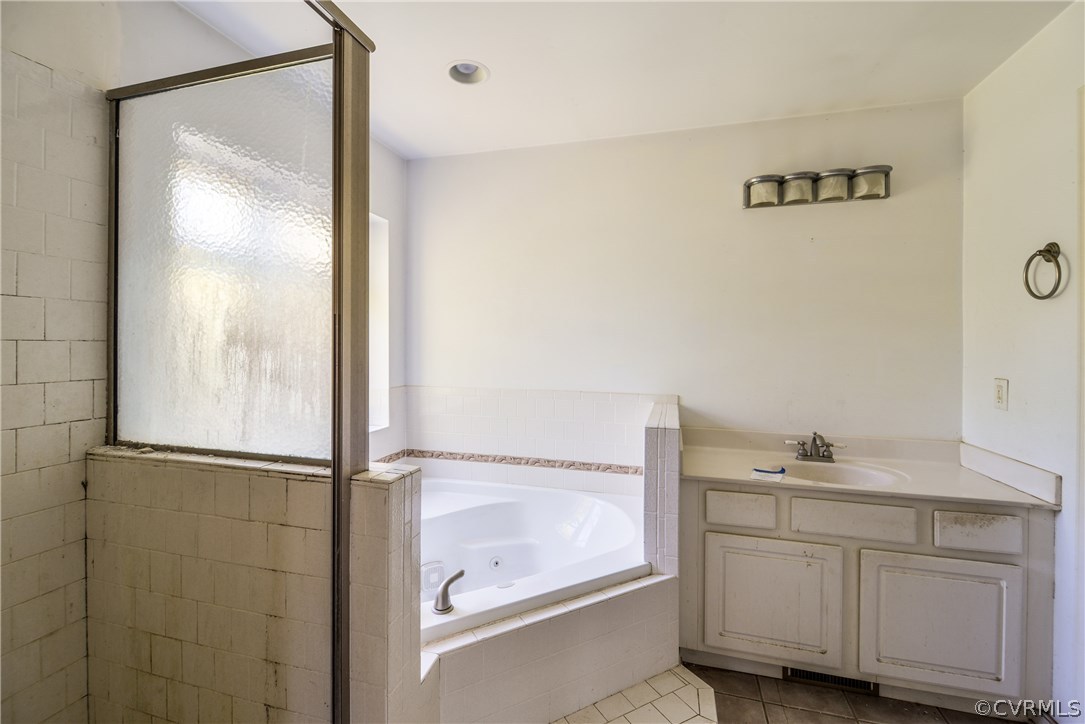 9025 Beach Road Chesterfield, VA 23838 - Photo 11 of 25 a bathroom with a shower sink and mirror