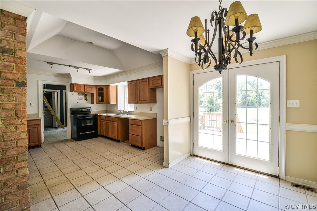 9025 Beach Road Chesterfield, VA 23838 - Photo 13 of 25 a kitchen with stainless steel appliances a sink a counter top space cabinets and a window