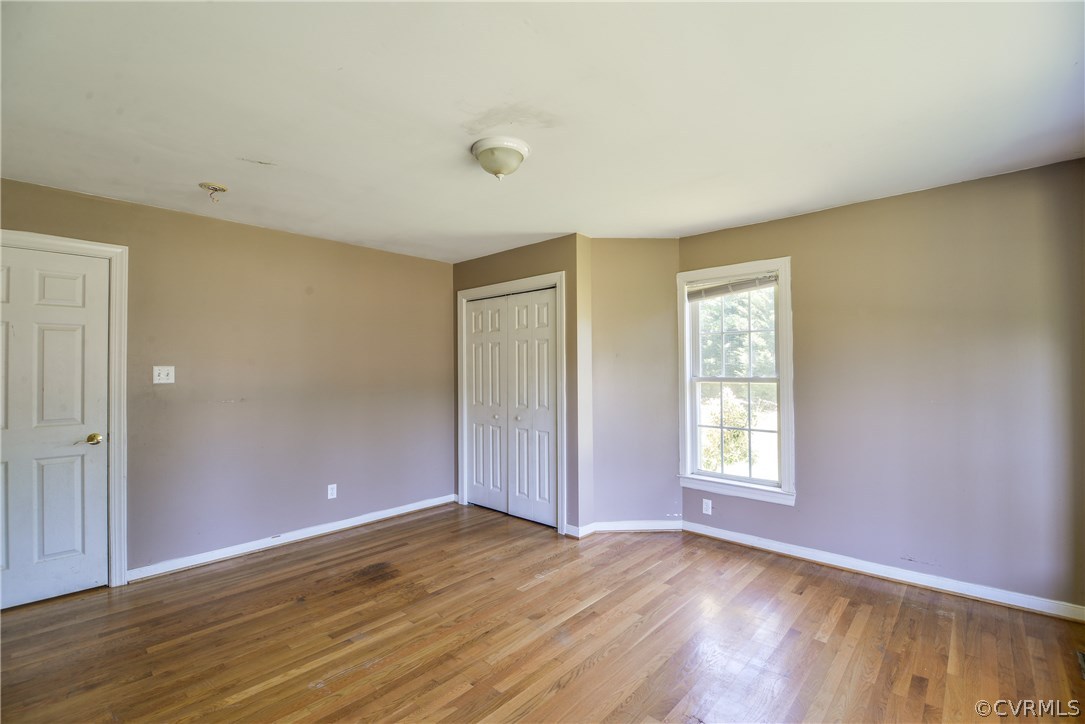 9025 Beach Road Chesterfield, VA 23838 - Photo 19 of 25 an empty room with wooden floor and windows