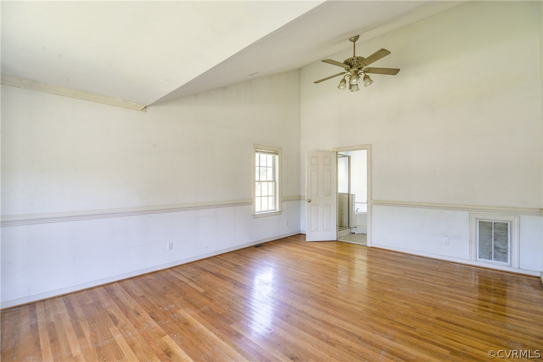 9025 Beach Road Chesterfield, VA 23838 - Photo 9 of 25 wooden floor in an empty room with a window