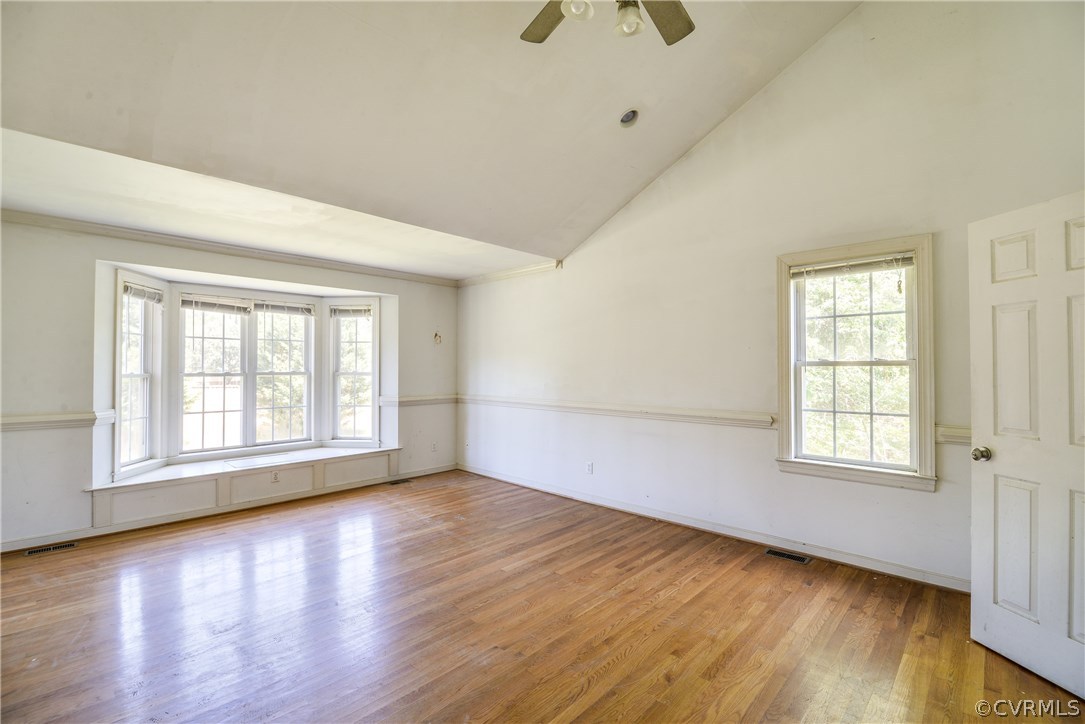 9025 Beach Road Chesterfield, VA 23838 - Photo 10 of 25 an empty room with wooden floor and windows
