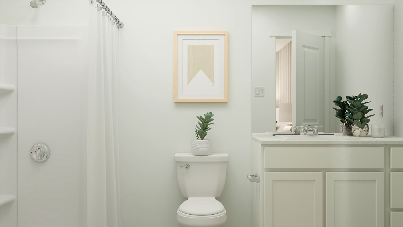 2210 Jeter Drive Bryan, TX 77807 - Photo 15 of 21 a bathroom with a sink a toilet and mirror