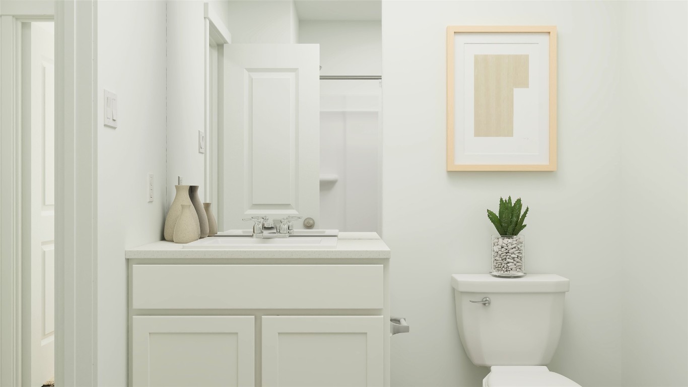 2210 Jeter Drive Bryan, TX 77807 - Photo 21 of 21 a bathroom with a sink a toilet and a mirror