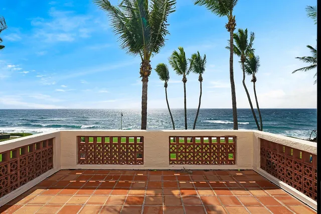 a view of a balcony with an ocean view
