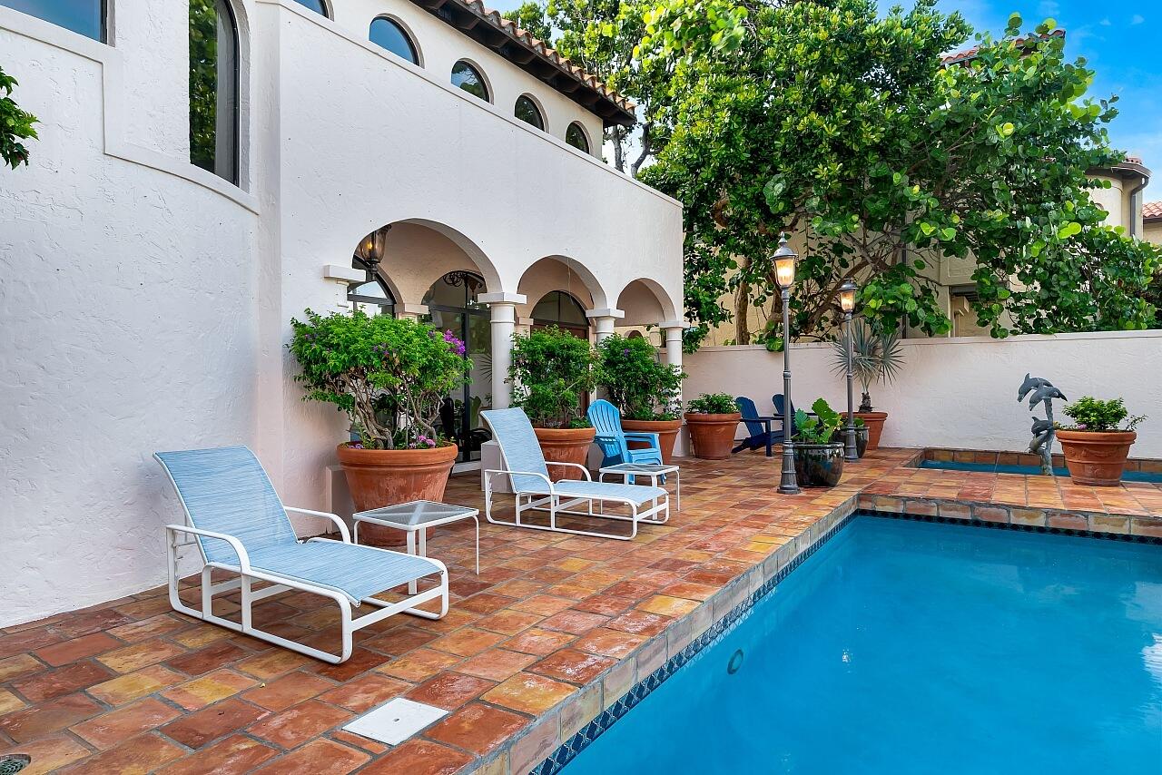 1 Ocean Lane Manalapan, FL 33462 - Photo 17 of 95 a view of a backyard with swimming pool and sitting area