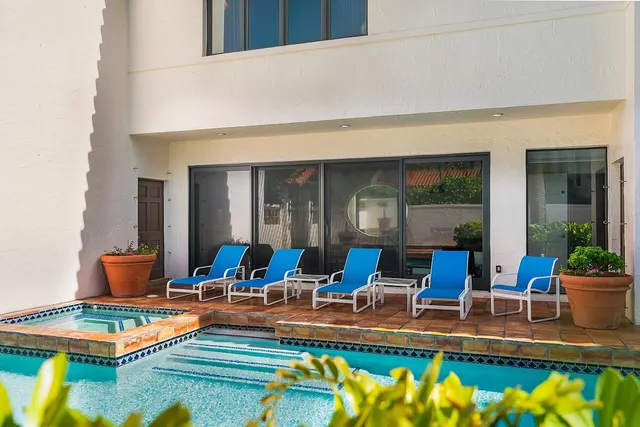 a living room with furniture and a rug