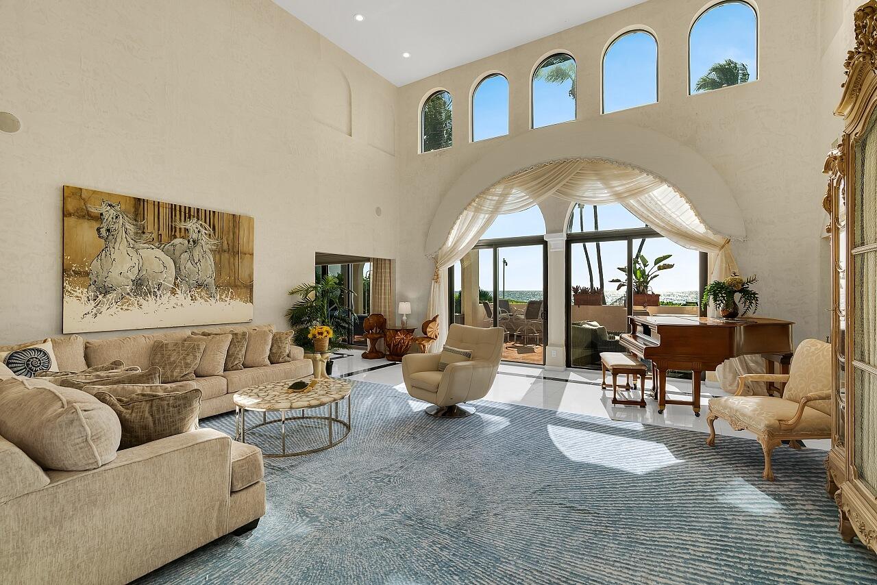 1 Ocean Lane Manalapan, FL 33462 - Photo 22 of 95 a living room with furniture and a large window