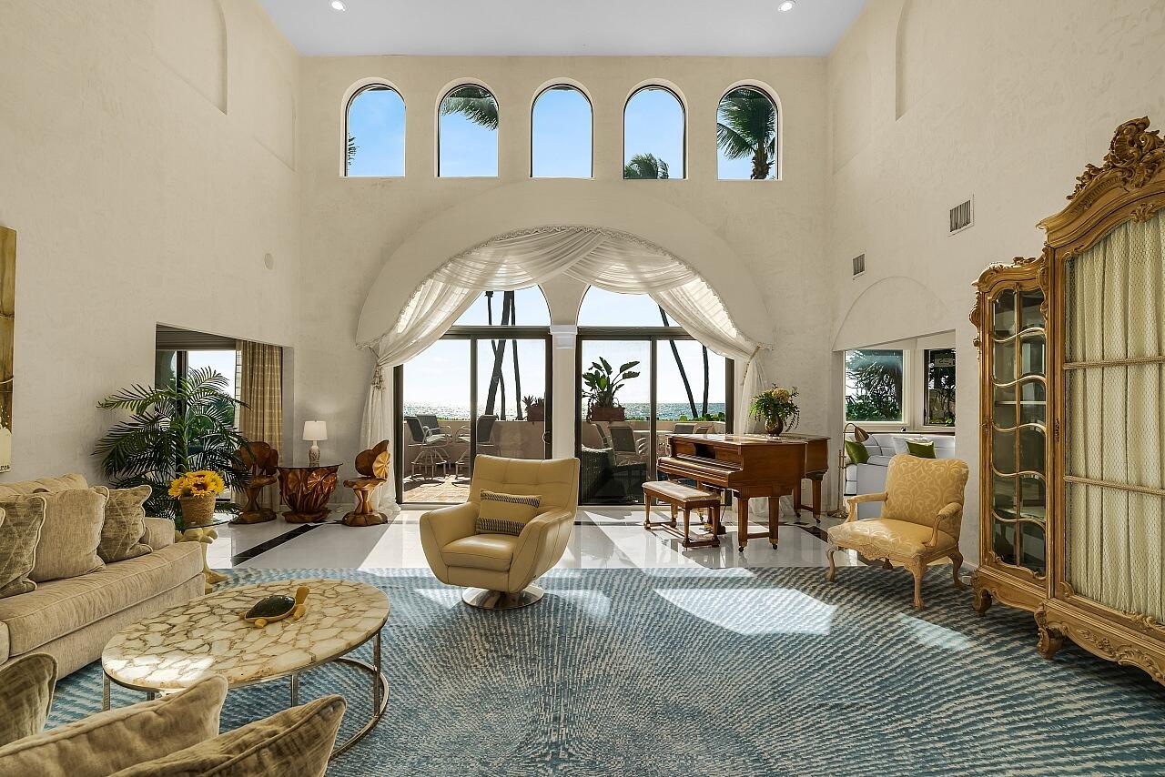 1 Ocean Lane Manalapan, FL 33462 - Photo 23 of 95 a living room with furniture fireplace and a large window