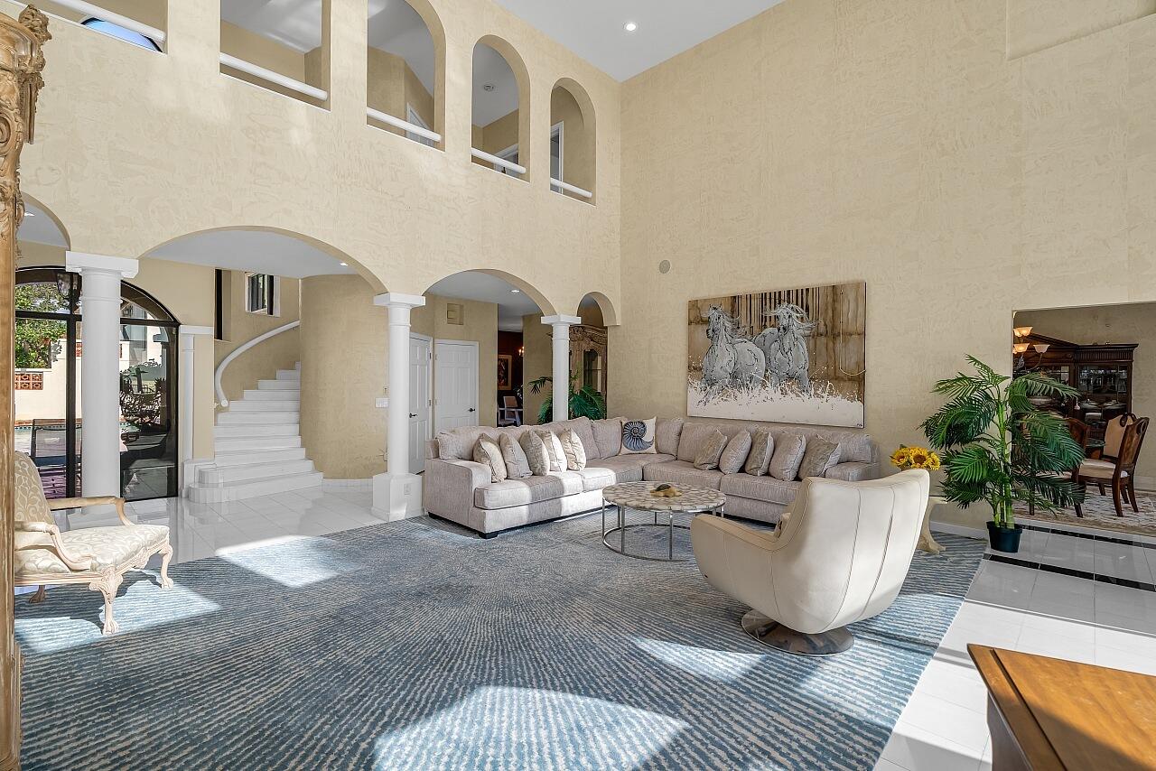 1 Ocean Lane Manalapan, FL 33462 - Photo 25 of 95 a living room with furniture and a potted plant