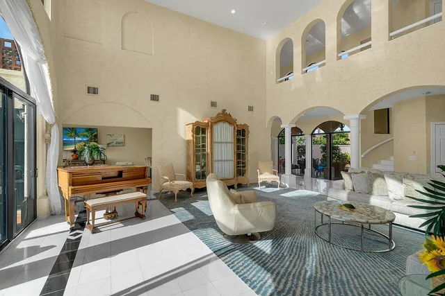 a dining room with furniture a livingroom and chandelier