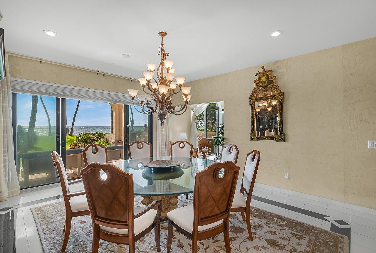 1 Ocean Lane Manalapan, FL 33462 - Photo 31 of 95 a view of a dining room with furniture a livingroom and chandelier