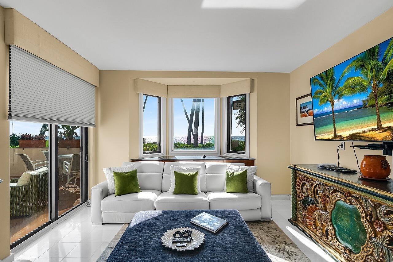 1 Ocean Lane Manalapan, FL 33462 - Photo 33 of 95 a living room with furniture and a flat screen tv