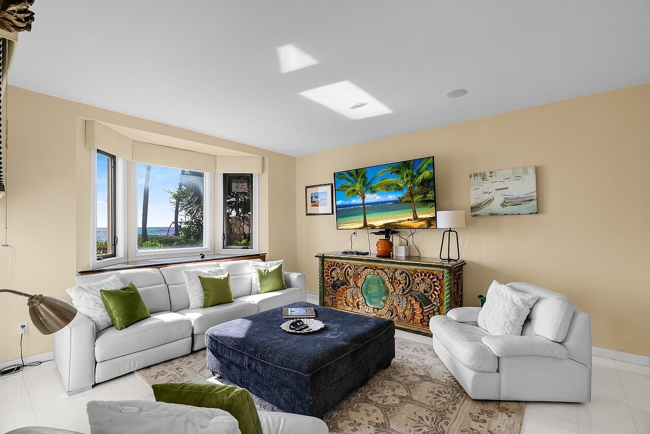 1 Ocean Lane Manalapan, FL 33462 - Photo 36 of 95 a living room with furniture and a flat screen tv