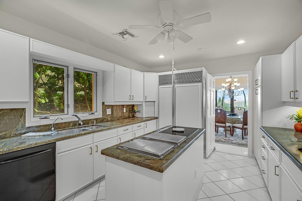 1 Ocean Lane Manalapan, FL 33462 - Photo 40 of 95 a kitchen with a stove a sink and a refrigerator