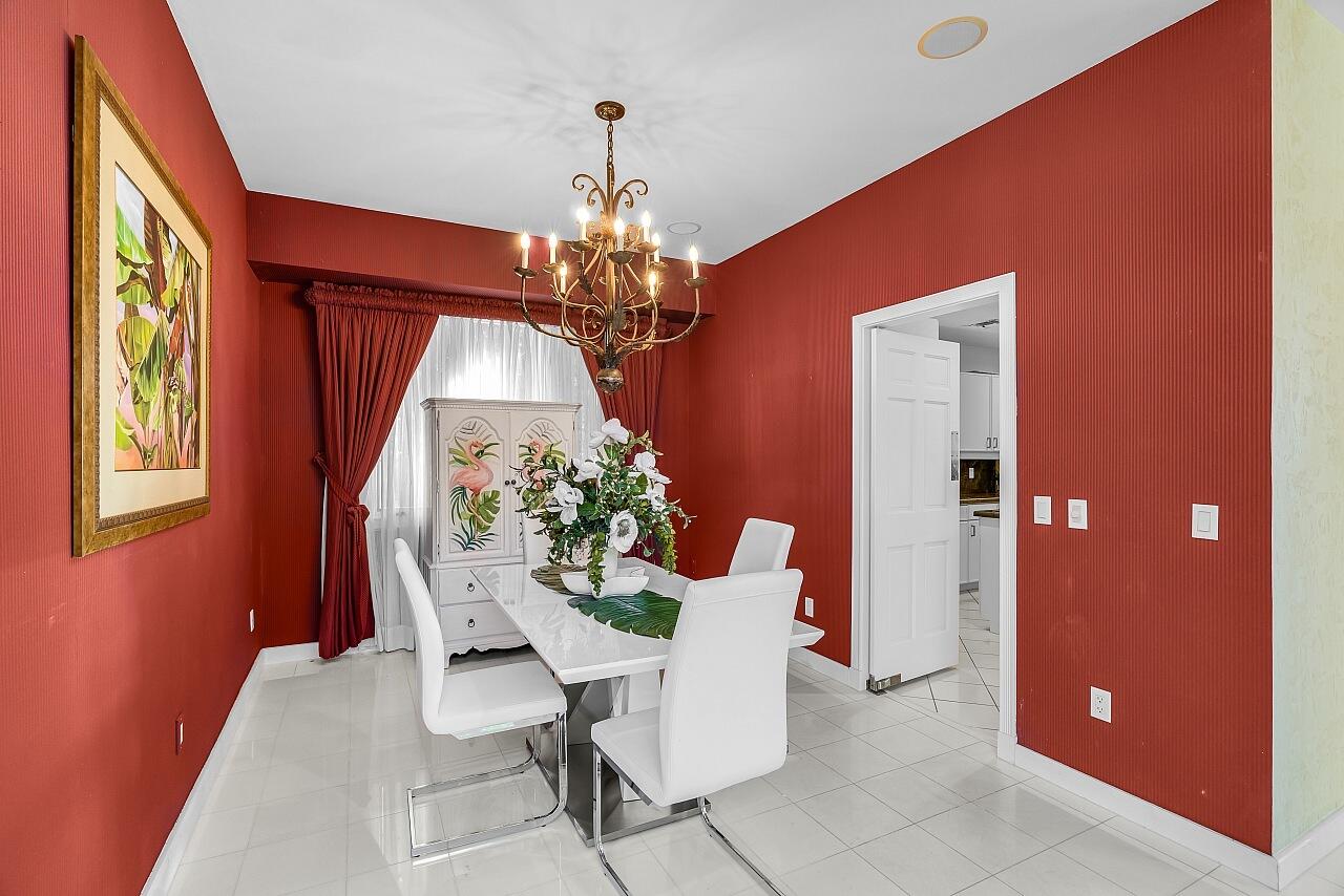 1 Ocean Lane Manalapan, FL 33462 - Photo 44 of 95 a dining room with furniture and window