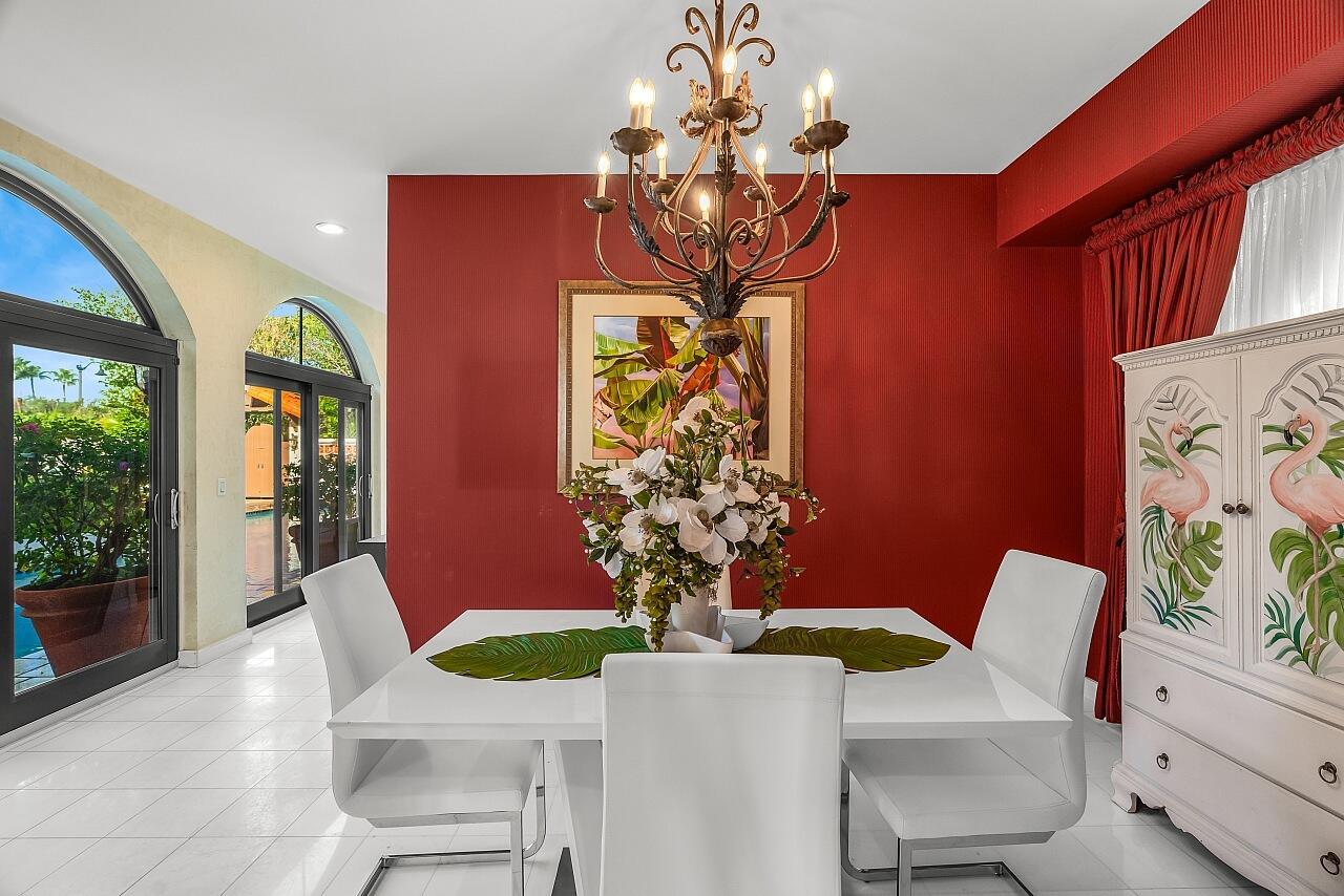 1 Ocean Lane Manalapan, FL 33462 - Photo 45 of 95 a dining room with furniture a livingroom and chandelier