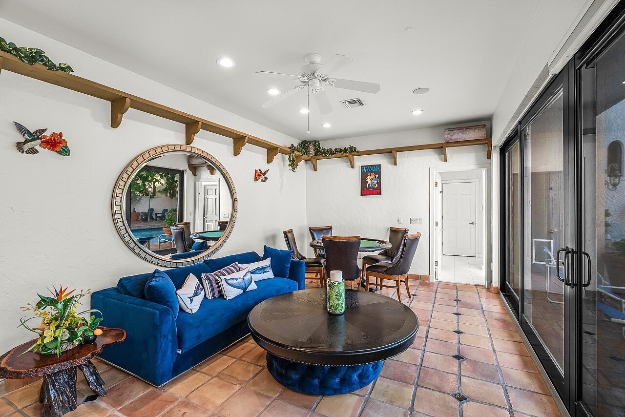 1 Ocean Lane Manalapan, FL 33462 - Photo 46 of 95 a living room with furniture a mirror and a clock