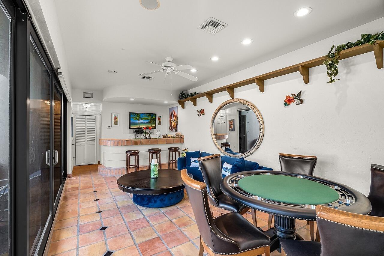 1 Ocean Lane Manalapan, FL 33462 - Photo 48 of 95 a living room with furniture and a fireplace