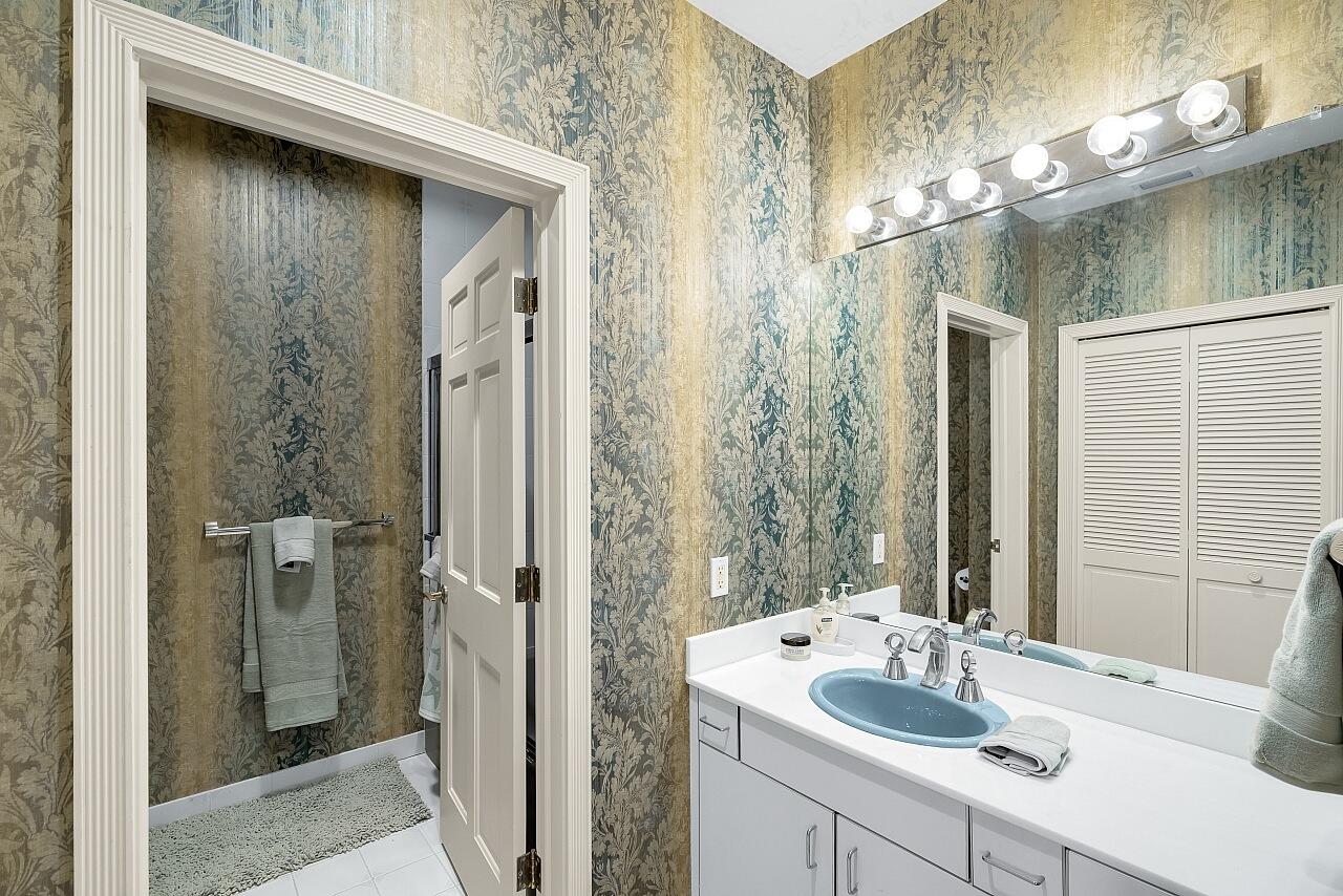 1 Ocean Lane Manalapan, FL 33462 - Photo 83 of 95 a bathroom with a sink and a mirror