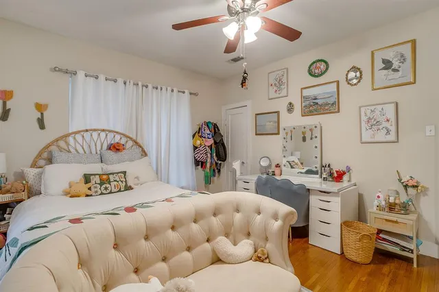 a bedroom that has a bed and a table in it