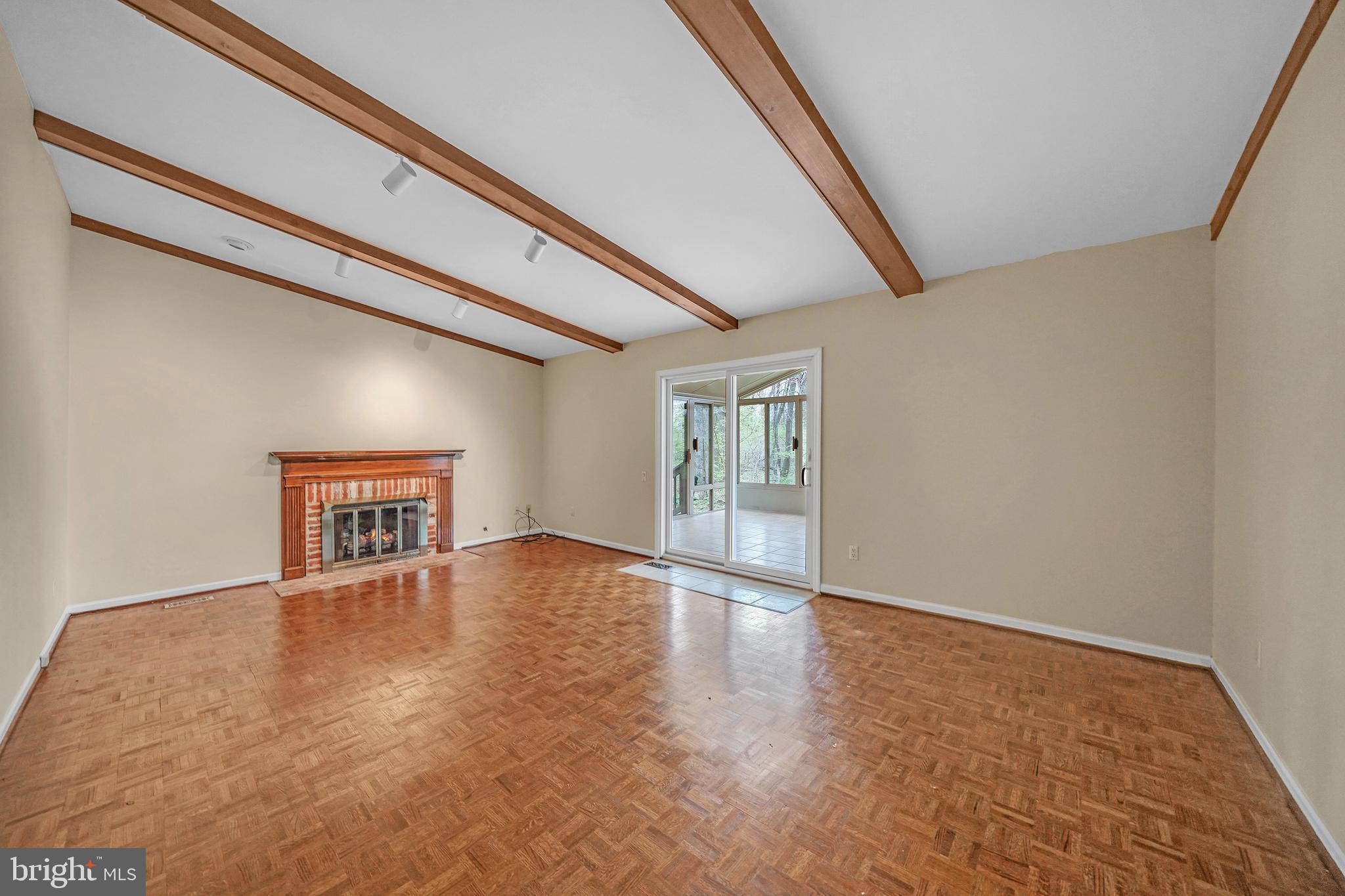 824 Meadowview Road Kennett Square, PA 19348 - Photo 14 of 39 Family room with fireplace leads to sun room
