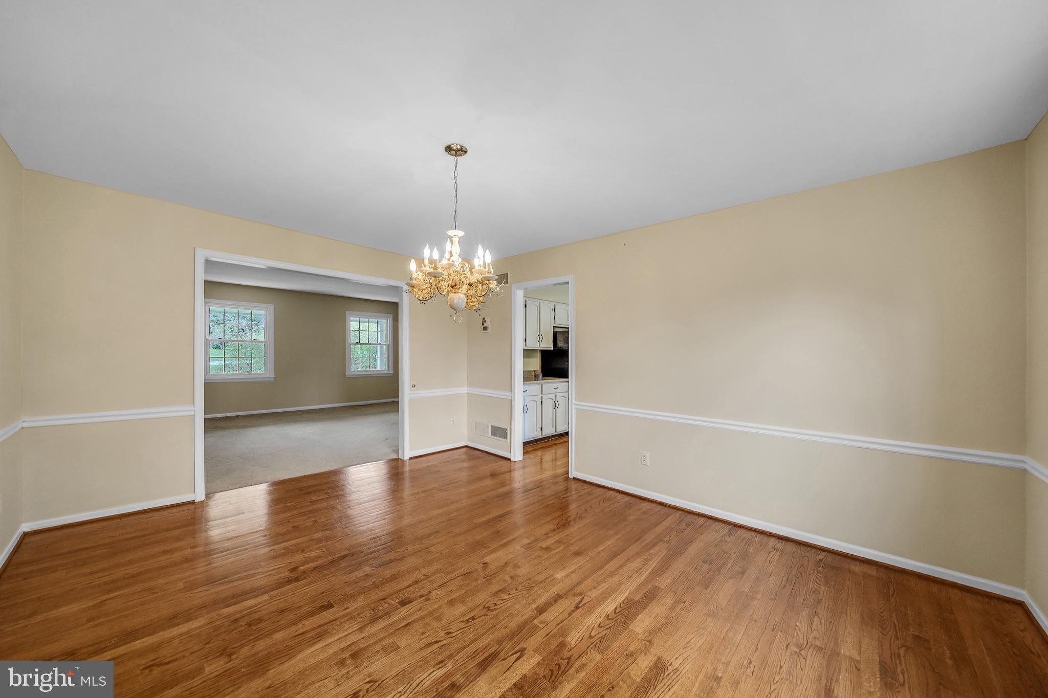 824 Meadowview Road Kennett Square, PA 19348 - Photo 6 of 39 Dining with wood floor and chair rail