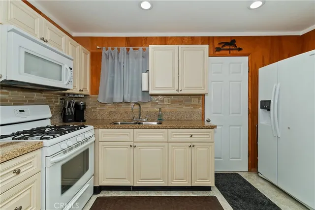 a view of a dining room with furniture and window