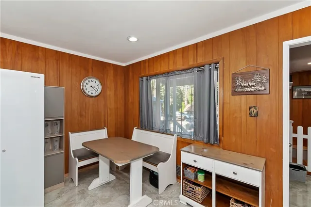 a kitchen with stainless steel appliances a stove a sink and a refrigerator