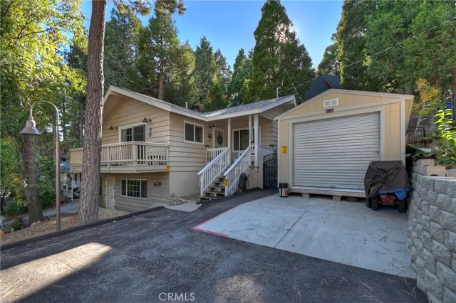 a view of a house with a yard and garage