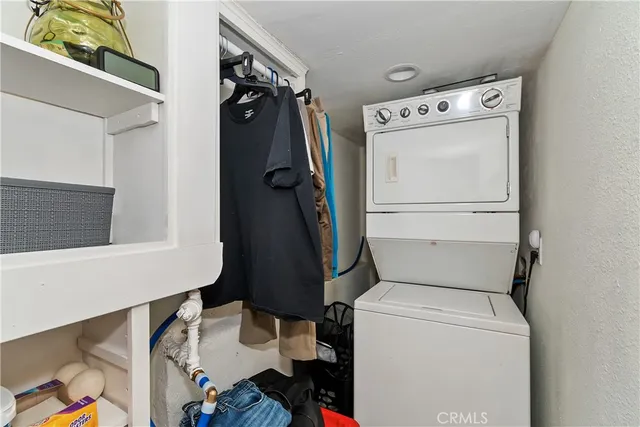 a room with furniture a air conditioner and a window