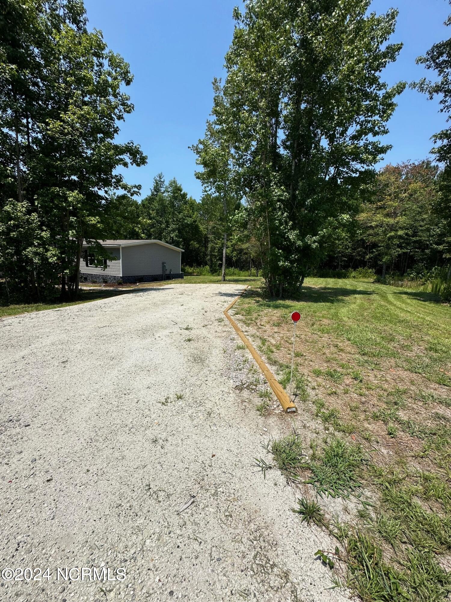 3299 Blueberry Road Currie, NC 28435 - Photo 30 of 34 driveway edit
