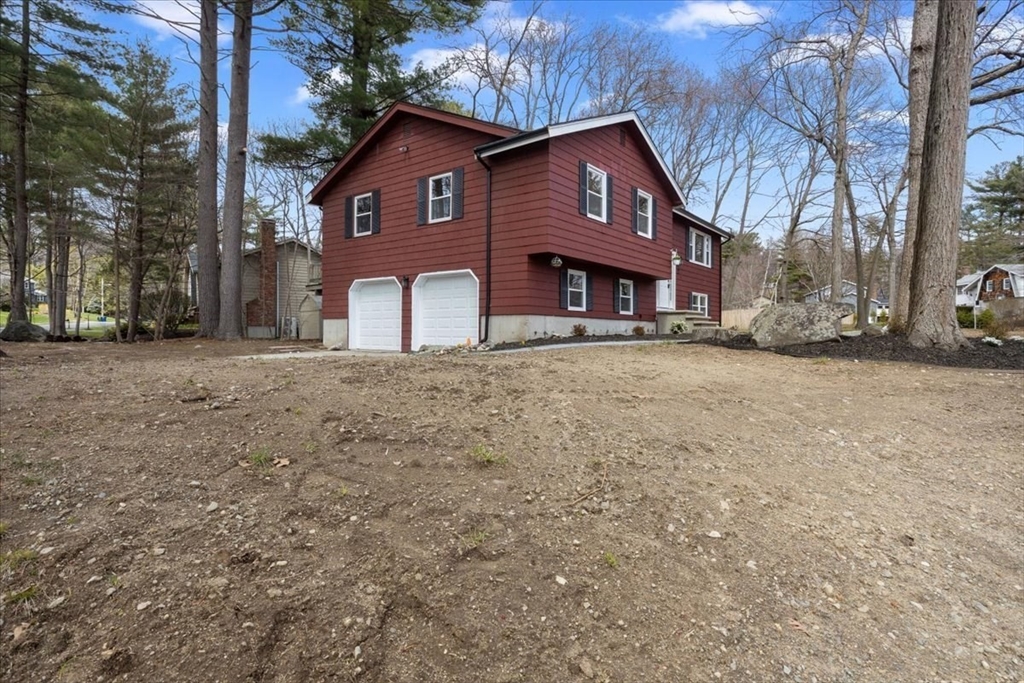 2 Thomas Road Danvers, MA 01923 - Photo 32 of 41 a front view of a house with a yard