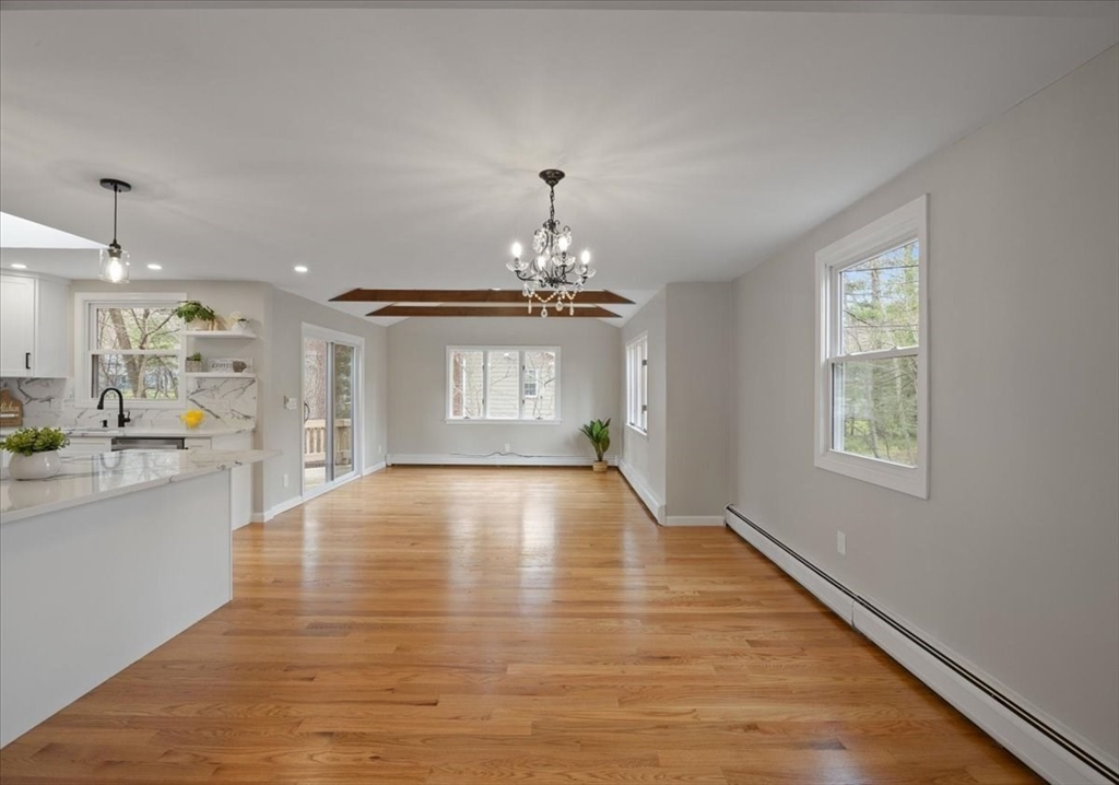 2 Thomas Road Danvers, MA 01923 - Photo 8 of 41 a view of an empty room with window and wooden floor
