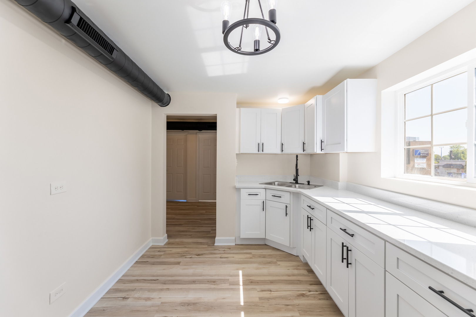 3243 Ridge Road, Unit 2 Lansing, IL 60438 - Photo 4 of 13 a kitchen with a sink and cabinets