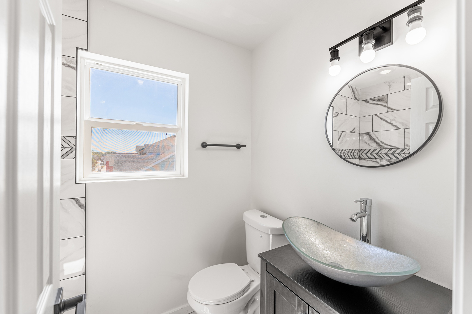 3243 Ridge Road, Unit 2 Lansing, IL 60438 - Photo 5 of 13 a bathroom with a toilet a sink and a mirror