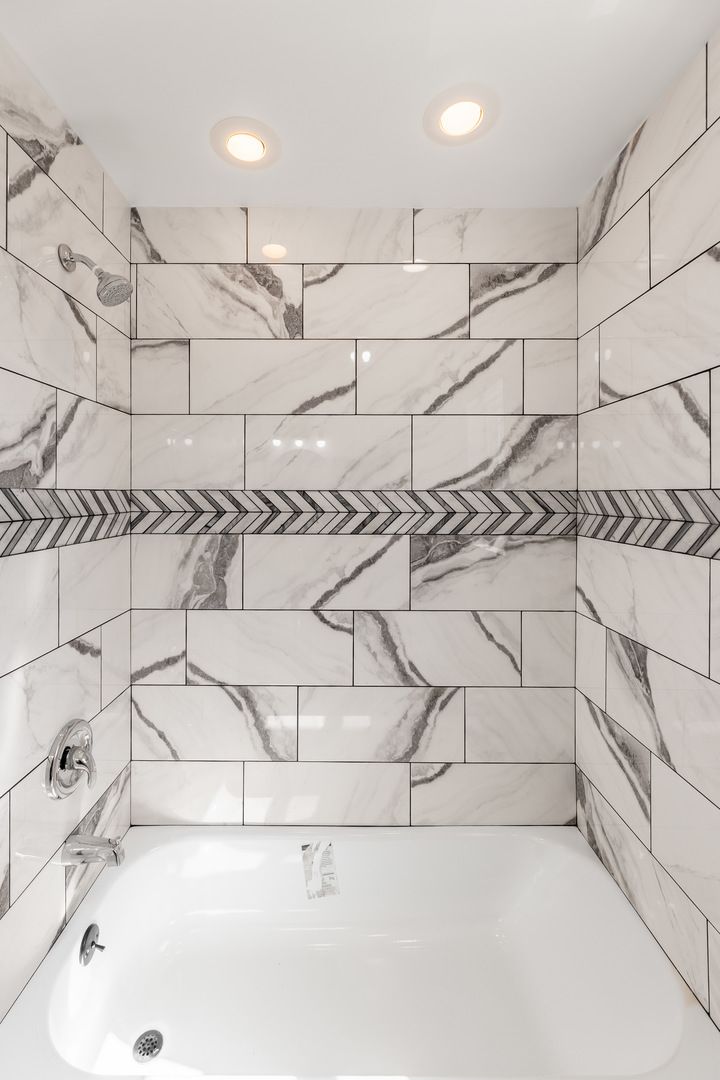 3243 Ridge Road, Unit 2 Lansing, IL 60438 - Photo 6 of 13 a bathroom with a bathtub and shower