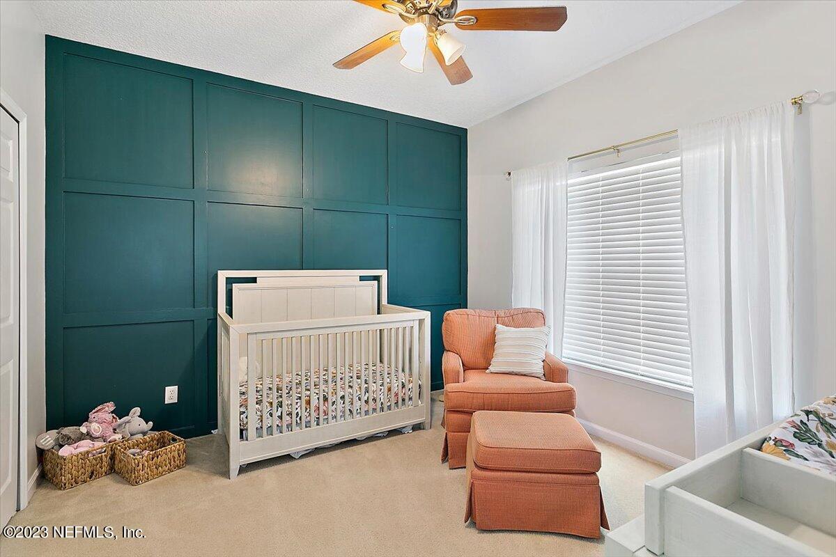 776 Constitution Place Macclenny, FL 32063 - Photo 14 of 30 a bedroom with furniture and a window