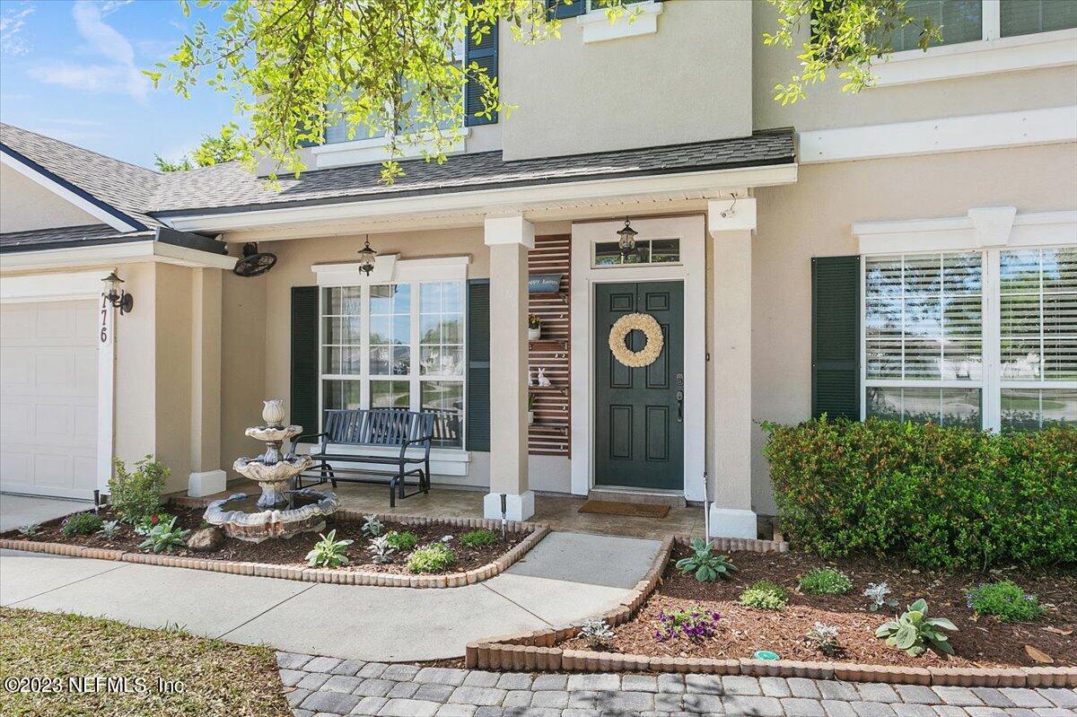 776 Constitution Place Macclenny, FL 32063 - Photo 3 of 30 a front view of a house with garden