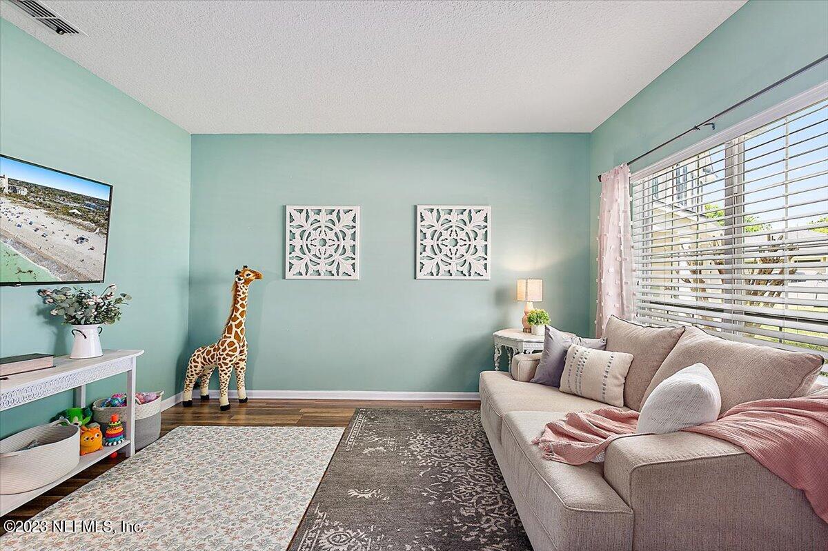 776 Constitution Place Macclenny, FL 32063 - Photo 6 of 30 a living room with furniture and a window