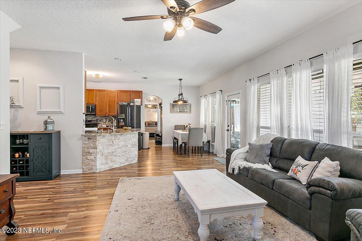 776 Constitution Place Macclenny, FL 32063 - Photo 7 of 30 a living room with furniture and a large window