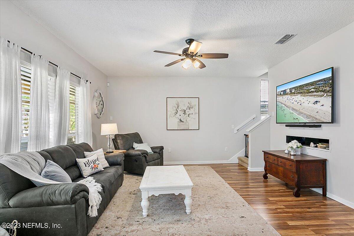776 Constitution Place Macclenny, FL 32063 - Photo 8 of 30 a living room with furniture a rug and a window