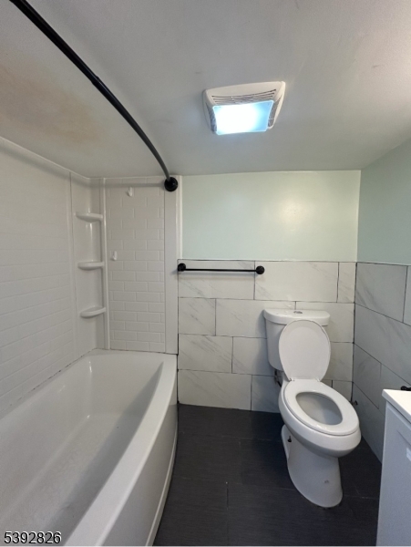 904 Cross Elizabeth, NJ 07208 - Photo 19 of 27 a bathroom with a toilet and bathtub